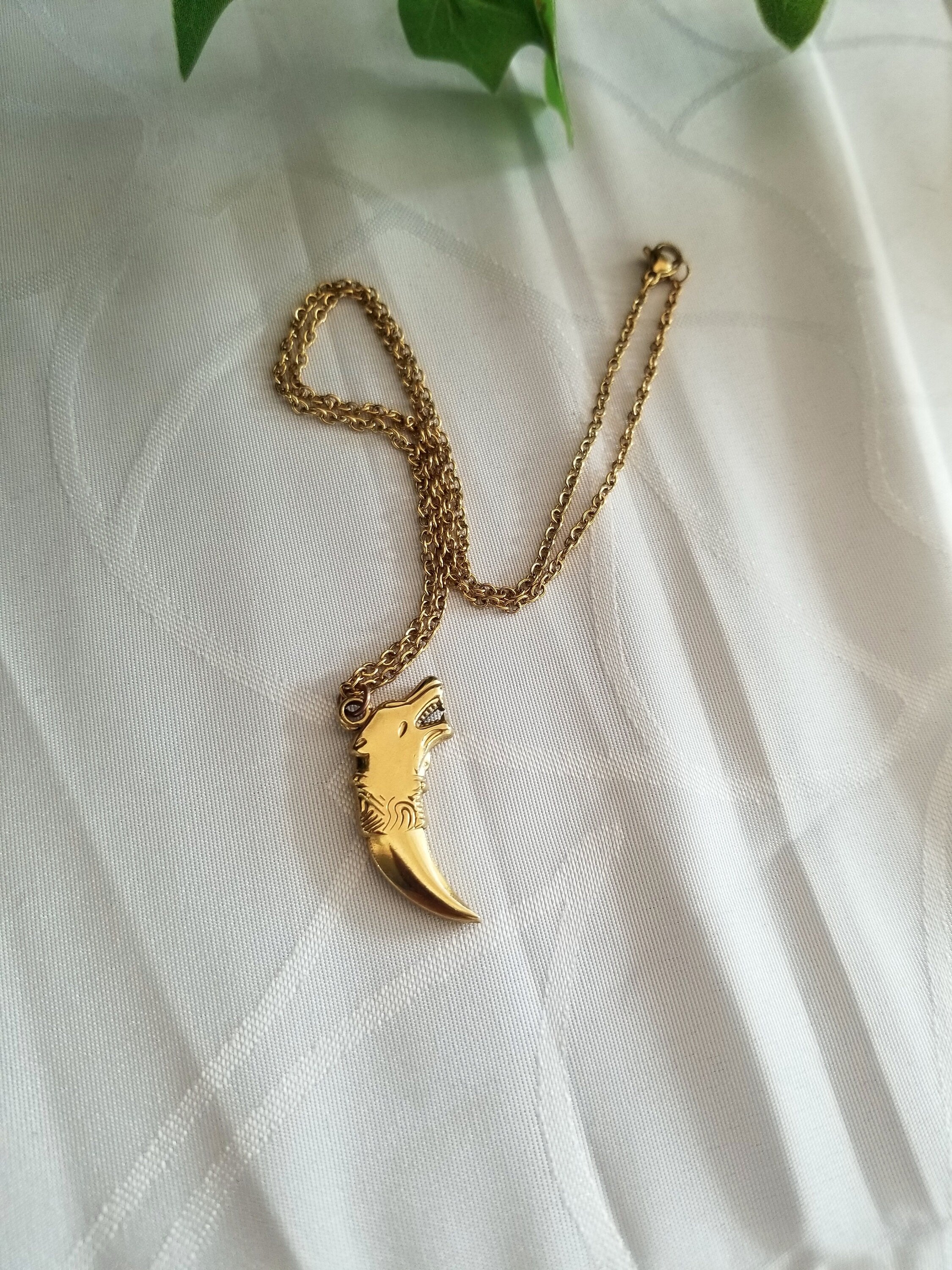 Gold Wolf Tooth Necklace: 18k Plated Stainless Steel Pendant
