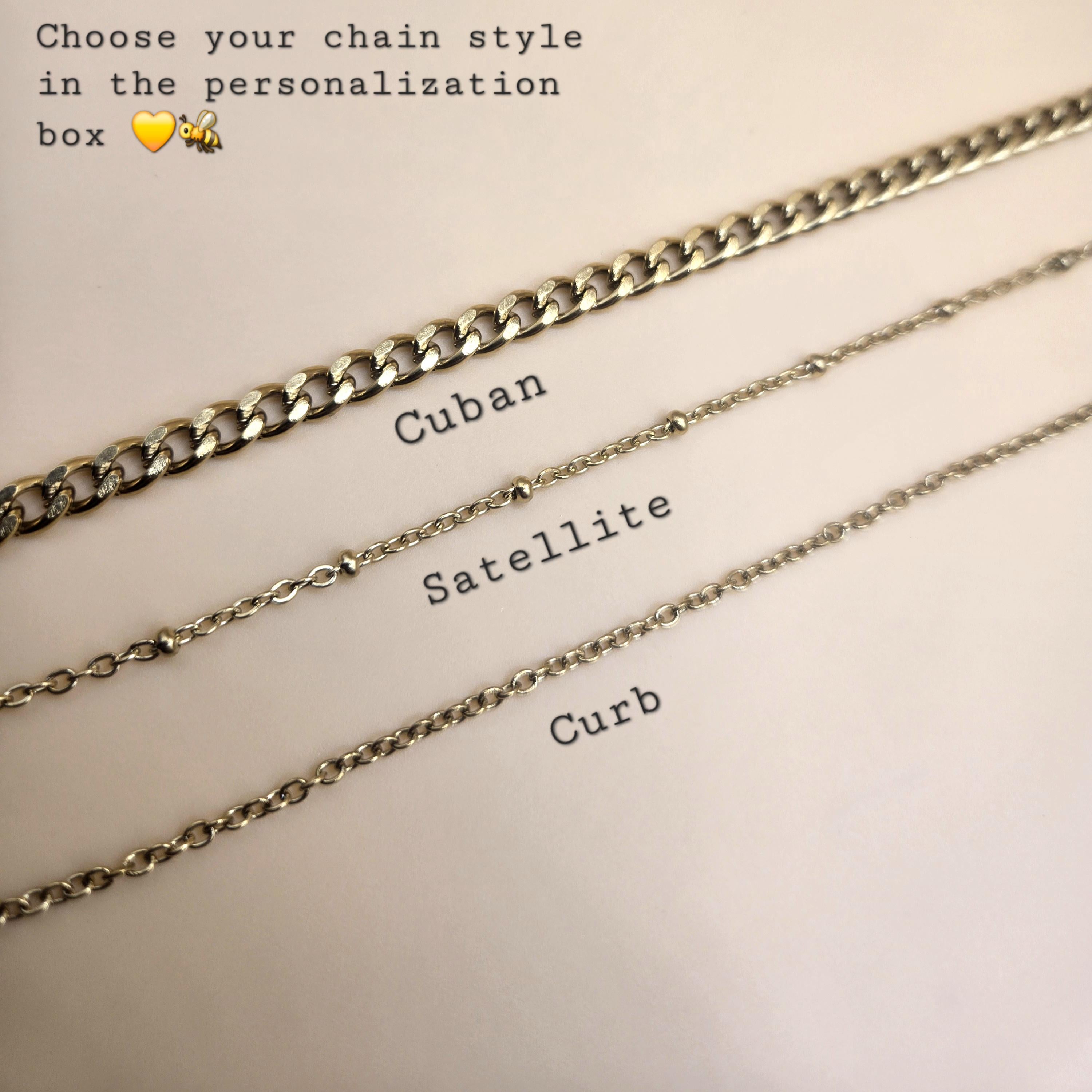 A product photo showcasing three 18k gold-plated chain options: a bold Cuban link, a delicate beaded Satellite chain, and a classic thin Curb chain. Text at the top instructs customers to 'Choose your chain style in the personalisation box' to customize their cross necklace order.